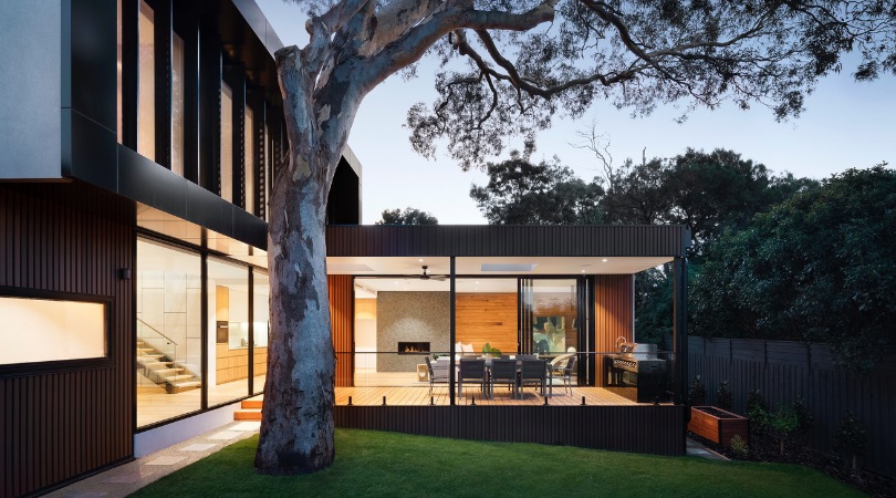 house extension at dusk with lights on